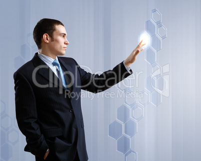 Businessman against technology background