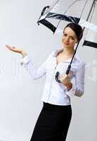 Young business woman with umbrella