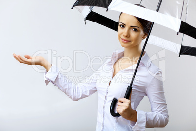 Young business woman with umbrella