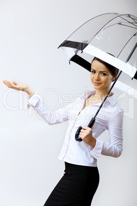 Young business woman with umbrella