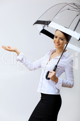 Young business woman with umbrella