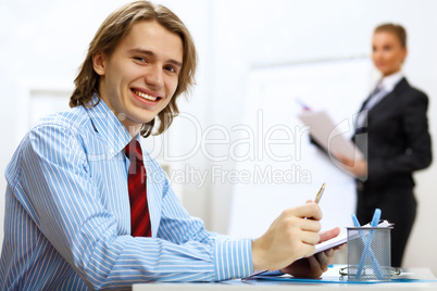 Young businessman at work in office