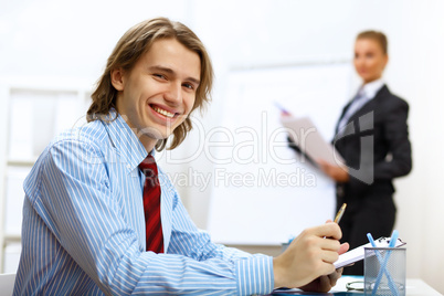 Young businessman at work in office