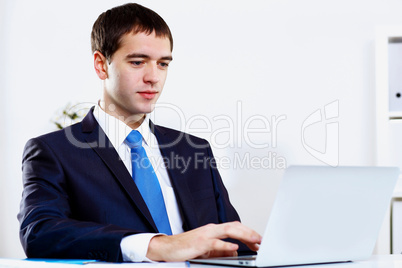 Young businessman in office