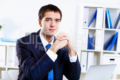 Young businessman in office