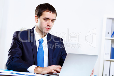 Young businessman in office