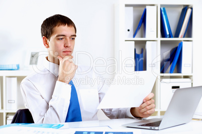 Young businessman in office