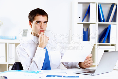 Young businessman in office