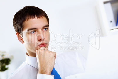 Young businessman in office