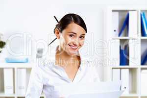 Young woman in business wear in office