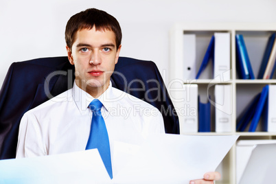 Young businessman in office