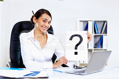 Young woman in business wear in office Young woman in business wear in office