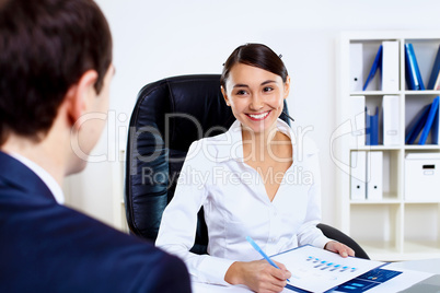 Young woman in business wear in office