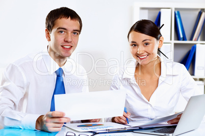 Two young business collegue in office