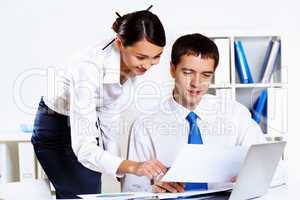 Two young business collegue in office