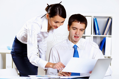 Two young business collegue in office