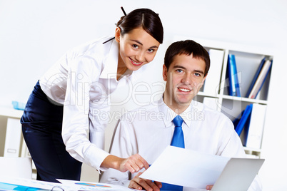 Two young business collegue in office