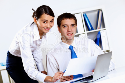 Two young business collegue in office