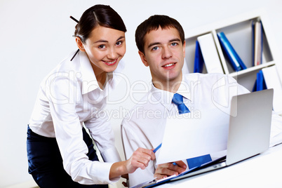 Two young business collegue in office