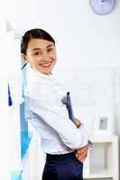 Young woman in business wear in office