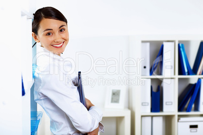 Young woman in business wear in office