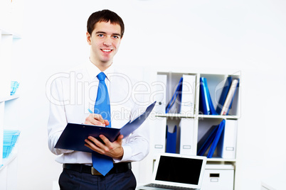 Young businessman in office