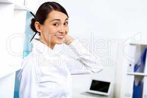 Young woman in business wear in office