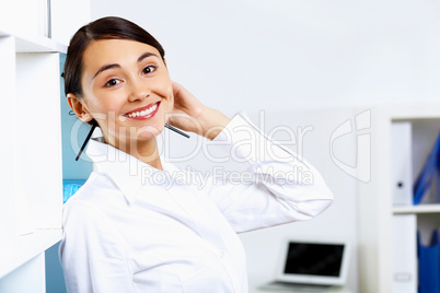 Young woman in business wear in office