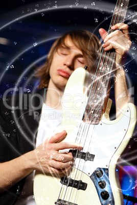 Young guitar player performing in night club