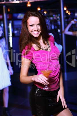 Young woman having fun at nightclub disco