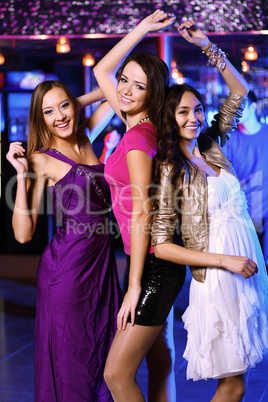 Young woman having fun at nightclub disco