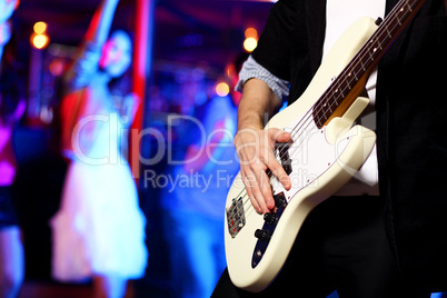Young guitar player performing in night club Young guitar player performing in night club