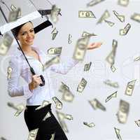 Business woman under money rain with umbrella