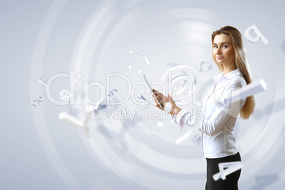 Woman in business wear with technology background