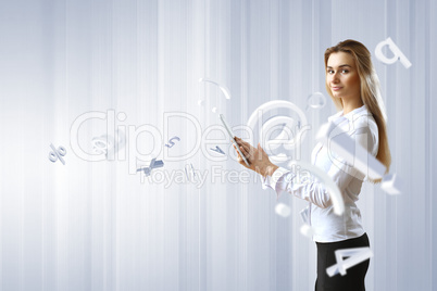 Woman in business wear with technology background