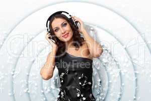 Young woman in evening dress with headphones