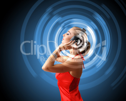 Young woman in evening dress with headphones