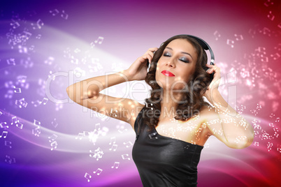 Young woman in evening dress with headphones