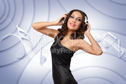 Young woman in evening dress with headphones