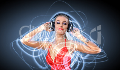 Young woman in evening dress with headphones