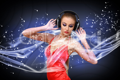 Young woman in evening dress with headphones