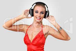 Young woman in evening dress with headphones