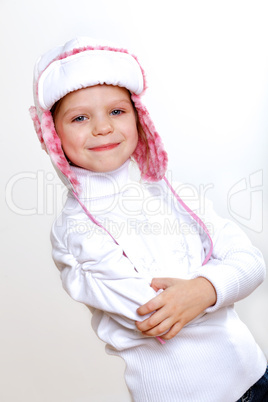 Kid in winter wear against white background