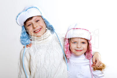 Kid in winter wear against white background