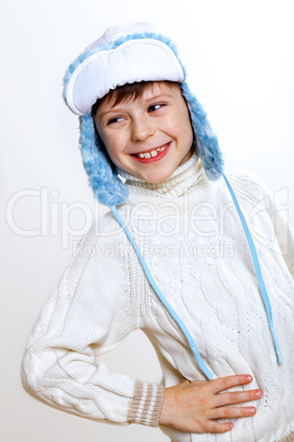 Kid in winter wear against white background