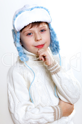 Kid in winter wear against white background