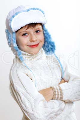 Kid in winter wear against white background