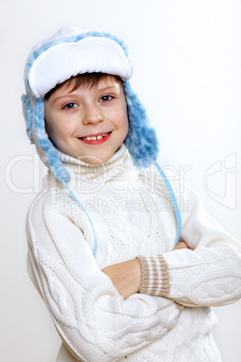 Kid in winter wear against white background