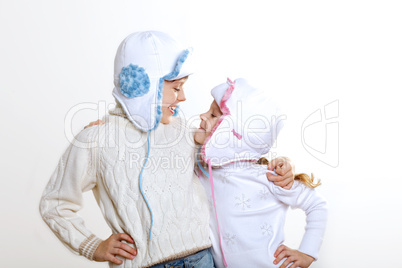 Kid in winter wear against white background