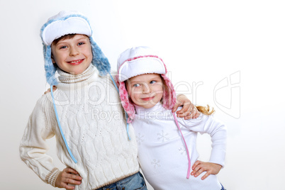 Kid in winter wear against white background